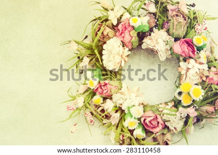 Background of floral wreath on grey paper texture.