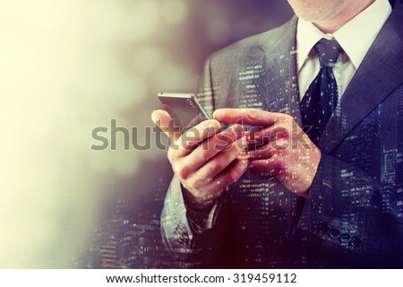 Close up of a man using mobile smart phone.