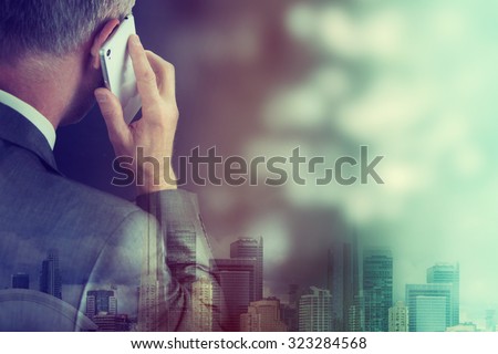 Business man making a phone call with smartphone.
