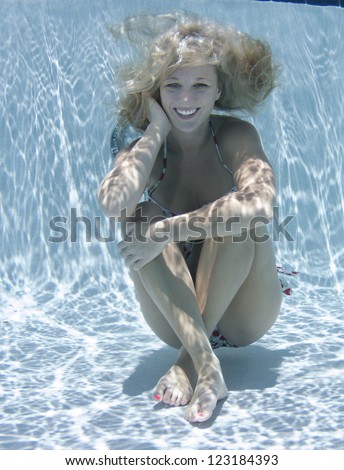 Smiling Blonde  Haired Model Underwater