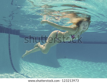Smiling Blond Haired Model Underwater