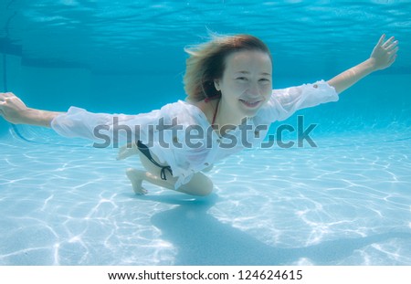 Smiling Blond Haired Model Underwater