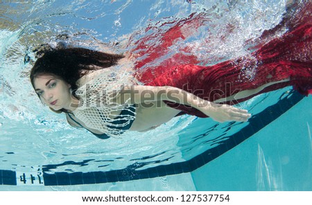 Smiling Dark Haired Model Underwater
