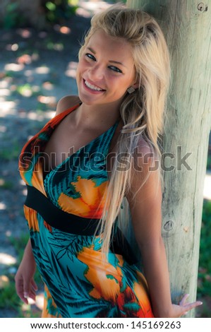 Blonde hair model with green eyes.