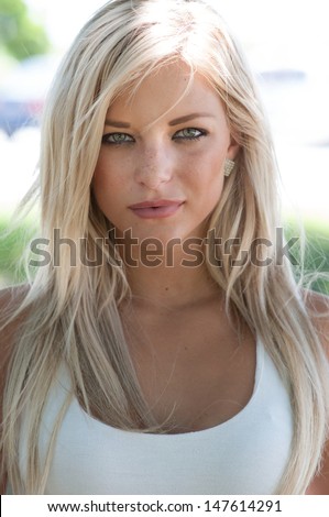Blonde hair model with green eyes.