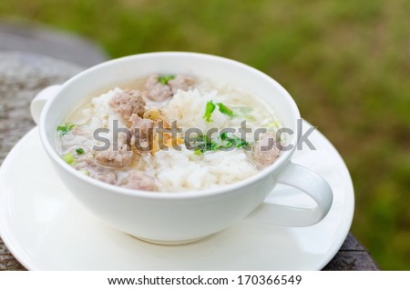 Boiled rice with pork in white  bowl. Thailand is a popular breakfast.