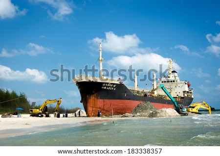 Songkhla, Thailand - March 09:The image of the salvage ship ORAPIN 4 is a liquefied natural gas tanker. The ship hit by Waves crashing ashore. On March 09,2014 at Samila Beach, Songkhla, Thailand.