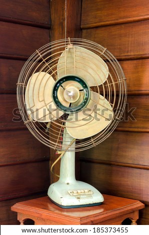 old electric fan on wood table