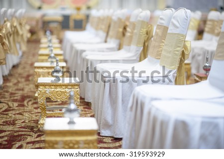 Many set of silver pot pour water with white chair for Wedding Ceremony in Thailand