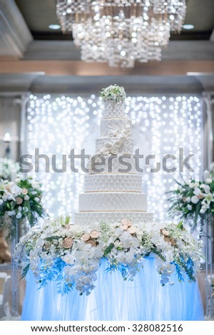 Image of a beautiful wedding cake at wedding reception and bokeh backdrop