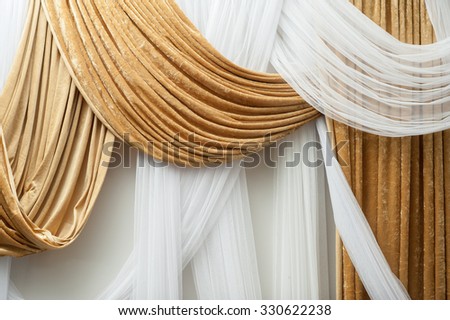 White and brown flannel  curtain decorate in the wedding hall for backdrop
