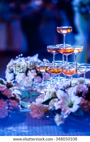 Set of champagne and wedding bouquet in outdoor wedding party at night in blue light image