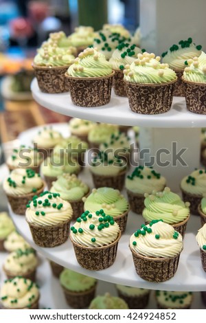 Sweet cupcakes : Cupcakes set up for wedding party, Design of cupcake in event or party at hotel. Decoration of Dessert cupcakes for buffet in restaurant.