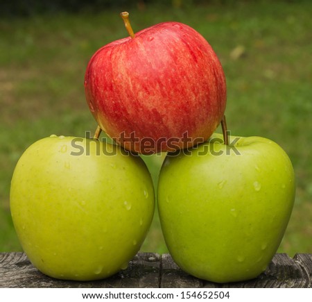One red apple with two green apple