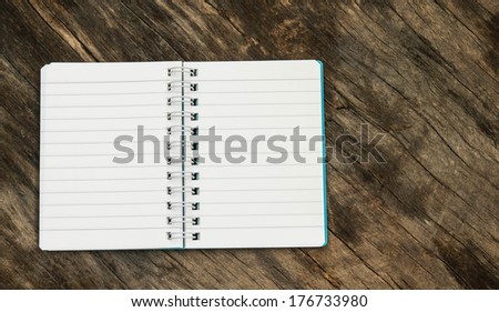 Notebook on the background of old wood.