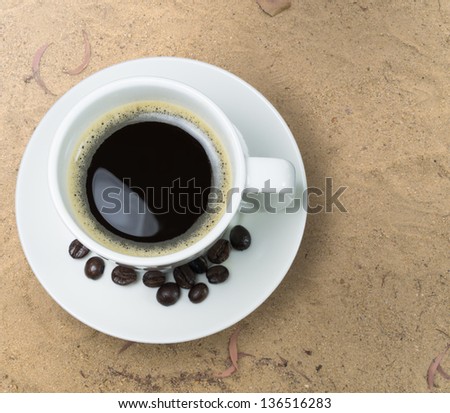 Espresso coffee on the sand beach