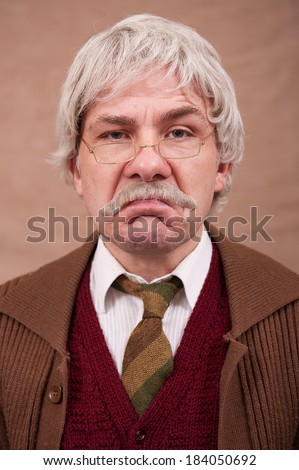 Portrait Of Grumpy Old Man