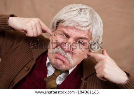 Old Man With Fingers In His Ears