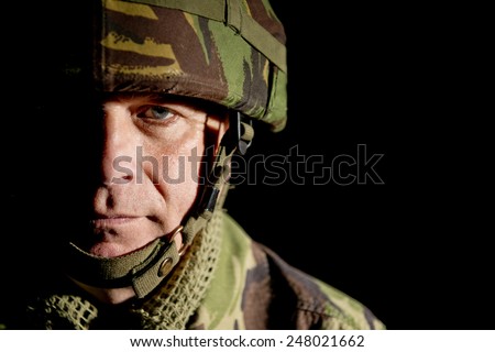 Soldier With Half Face In Shadow