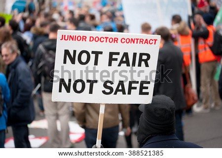 Downing Street, London, UK. 6th February 2016. EDITORIAL - Supporters with placards, at a rally outside Downing Street, London, in protest of government plans to change NHS junior doctor contracts.