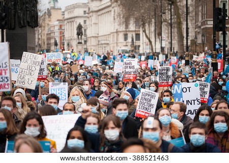 Downing Street, London, UK. 6th February 2016. EDITORIAL - Supporters with placards, at a rally outside Downing Street, London, in protest of government plans to change NHS junior doctor contracts.