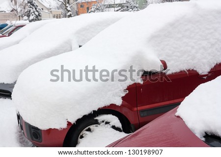 car covered with snow in winter