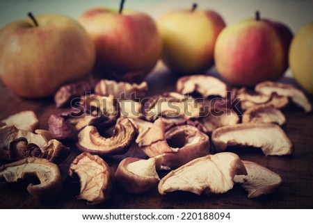 pieces of dried apple with apple background