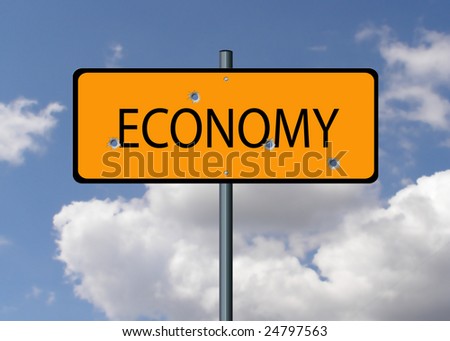 Economy road sign with bullet holes