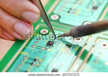 Soldering on Hi-Tech electronic circuit board