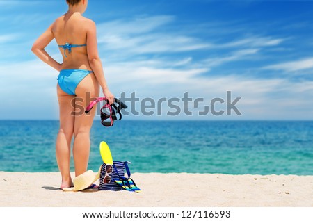 Young woman on the beach. Water sport. Shallow DOF.