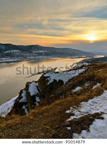 Winter landscape. Mountains and river.