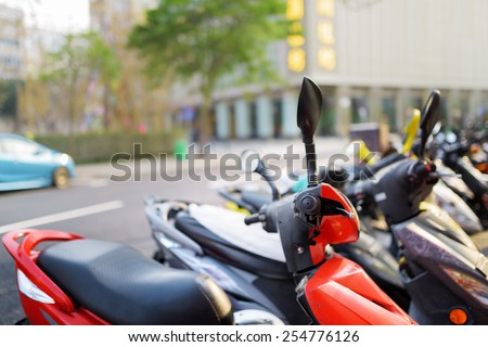 Motorbikes parked on the street of Macau. Macau is a popular tourist attraction of Asia and leading casino market of the world.