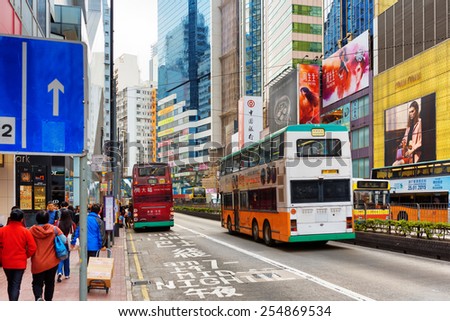 HONG KONG - JANUARY 28, 2015: Decker buses on the central streets. Hong Kong is a leading financial centre of the world.