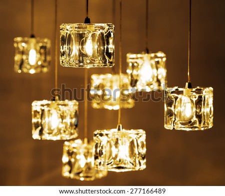 Closeup view of contemporary light fixture. Small bright lights creating a festive and romantic atmosphere.