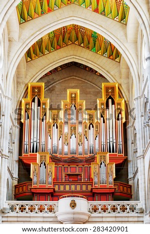 MADRID, SPAIN - AUGUST 18, 2014: The pipe organ in the Cathedral of Saint Mary the Royal of La Almudena in Madrid, Spain. Madrid is a popular tourist destination of Europe.