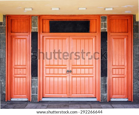 Red doors leading into a Buddhist temple located under the bronze statue of Tian Tan Buddha (the Big Buddha) at Lantau Island, in Hong Kong. Hong Kong is popular tourist destination of Asia.