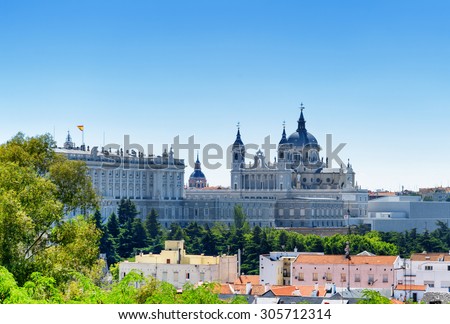 Beautiful view of the Royal Palace of Madrid and the Cathedral of Saint Mary the Royal of La Almudena on the blue sky background in Spain at summer. Madrid is a popular tourist destination of Europe.