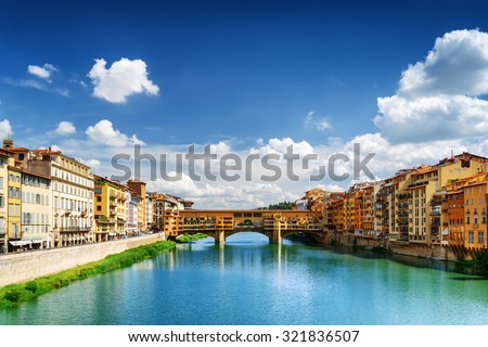 View of medieval stone bridge Ponte Vecchio and the Arno River from the Ponte Santa Trinita (Holy Trinity Bridge) in Florence, Tuscany, Italy. Florence is a popular tourist destination of Europe.