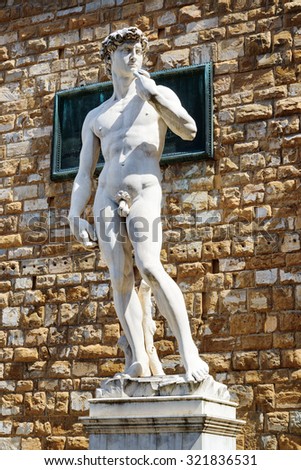 Full-sized replica of the original statue of David (by Michelangelo) in front of the Palazzo Vecchio on the Piazza della Signoria, Florence, Italy. Florence is a popular tourist destination of Europe.
