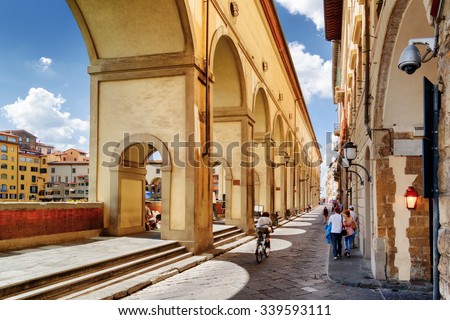 Arches of the Vasari Corridor (Corridoio Vasariano) in Florence, Tuscany, Italy. View of the Lungarno degli Archibusieri. Florence is a popular tourist destination of Europe.