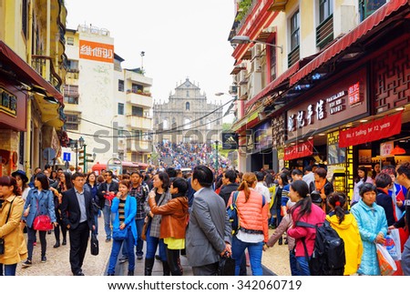 MACAU - JANUARY 30, 2015: The Street leading to the Ruins of St. Paul\'s Cathedral in the historic centre of Macau. Macau is a popular tourist attraction of Asia in the holidays.