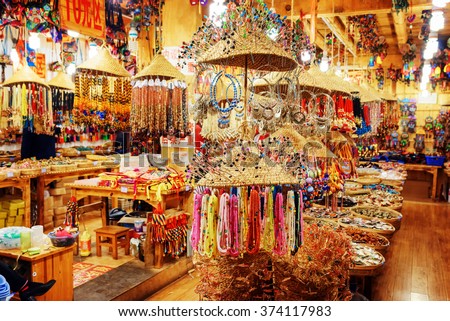 LIJIANG, YUNNAN PROVINCE, CHINA - OCTOBER 23, 2015: Gift shop at the Old Town of Lijiang offers wide range of traditional Chinese souvenirs. Lijiang is a popular tourist destination of Asia.