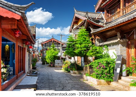 Scenic view of narrow street in the Old Town of Lijiang, Yunnan province, China. The Old Town of Lijiang is a popular tourist destination of Asia.