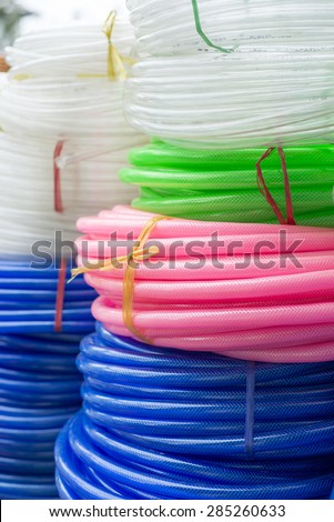 Colorful plastic rolled up hose or cable