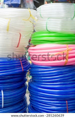 Colorful plastic rolled up hose or cable