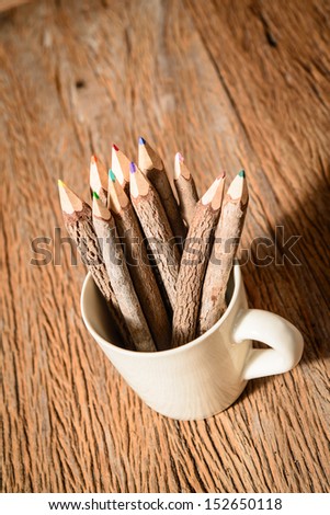 color pencil made of branches in coffee cup