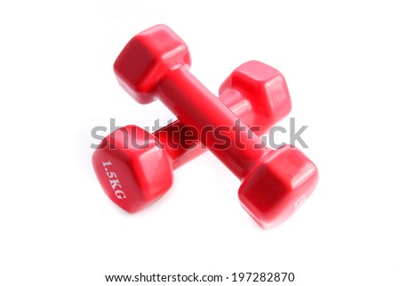 Two red dumbbells on white background. Light weight, one kilogram