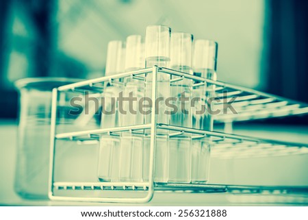 Laboratory glassware with liquid in vintage filtered style