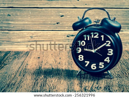 old style alarm clock in vintage filtered style