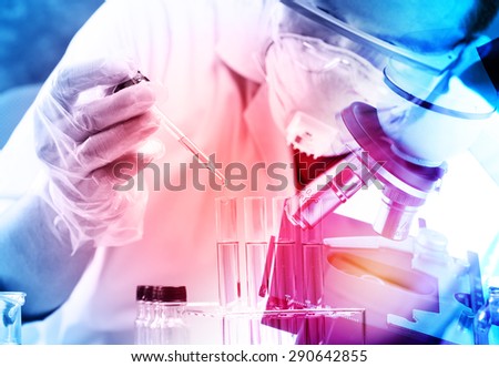scientist  dropping chemical liquid to flask with lab glassware background, Laboratory research concept